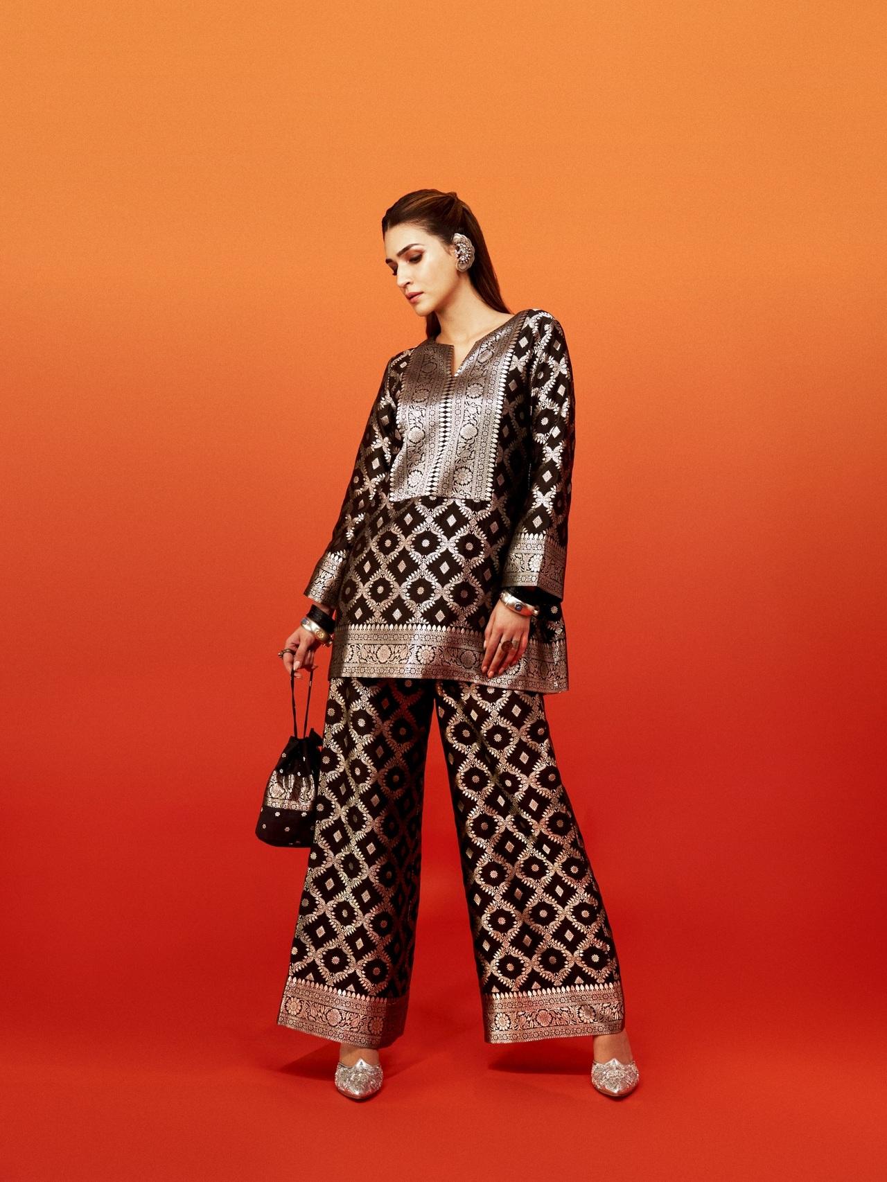 <p>Her accessories elevate the look even further. A sculptural ear cuff added an edgy contrast to the traditional brocade along with bangles and rings.&nbsp;</p>